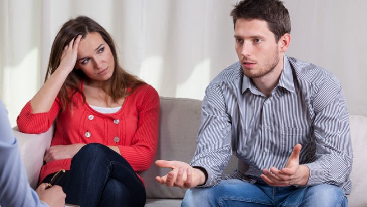 Couple interacting with attorney or mediator